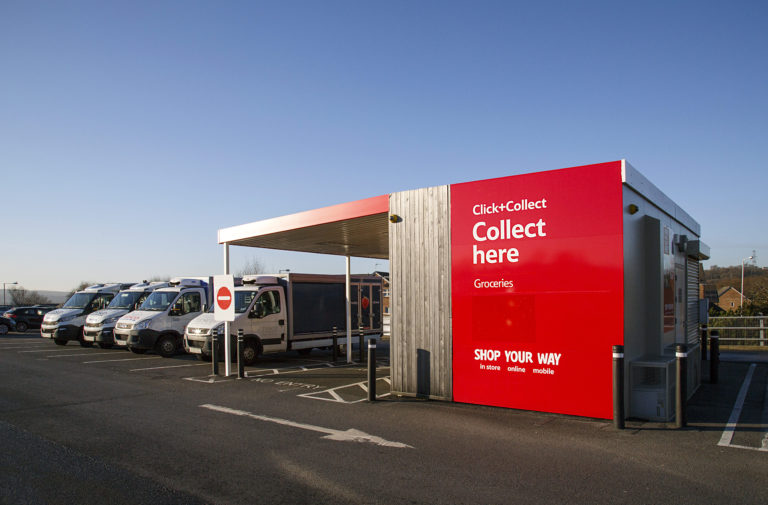 Swansea, UK: December 28, 2016: Tesco Click and Collect. Order shopping online and collect from a local store for free. Delivery vans are parked alongside