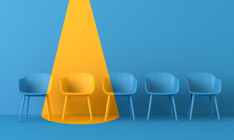 Yellow chair standing out from the crowd. Business concept