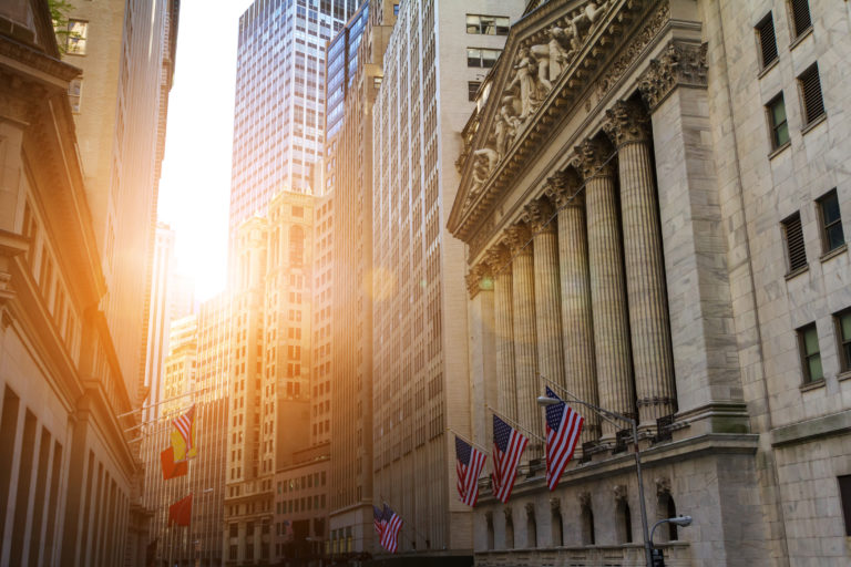 Sunlight shines on the historic buildings of the financial distr