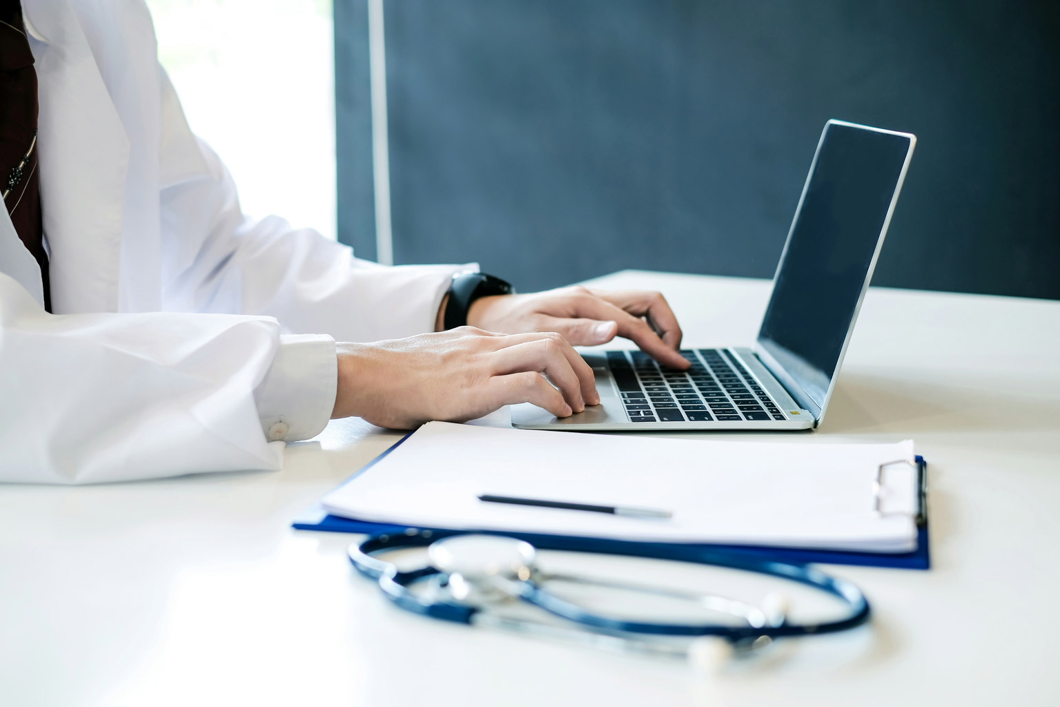 Healthcare provider on laptop